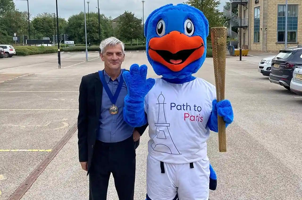 Allianz mascot, blue bird with orange beak