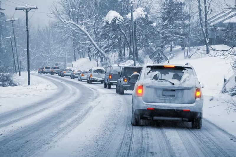 Cars driving down an icy road