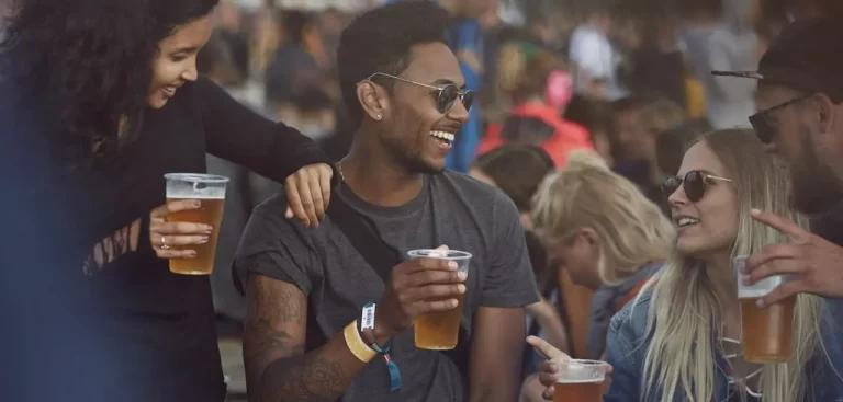 Young people enjoying beer at a festival