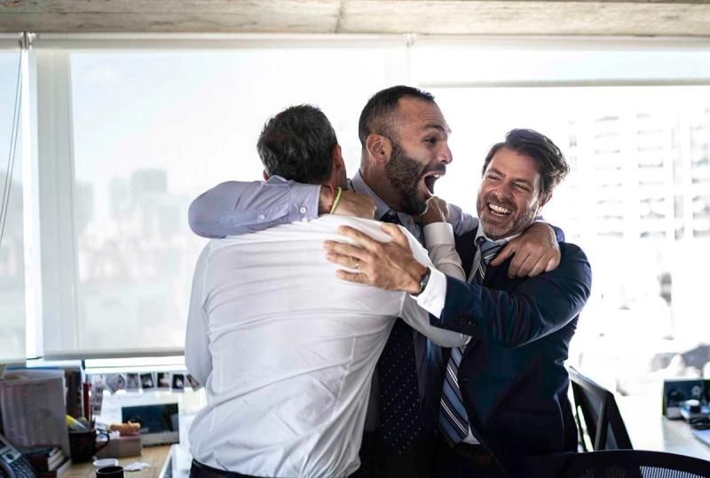 Office workers celebrating a goal